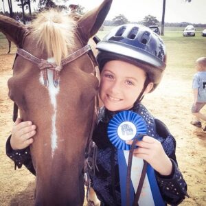 rider with horse show ribbon
